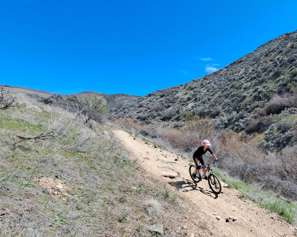 kristen riding downhill on the polygon xtrada